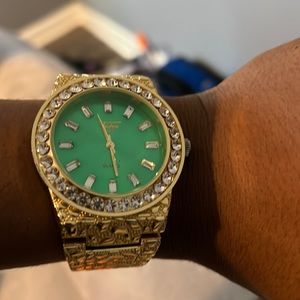Gold watch and jewel bracelet